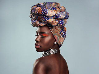 Image showing Black woman, profile and African turban, fashion and beauty with makeup isolated on studio background. Natural cosmetics, eyeshadow and female model with traditional head wrap, mockup space and style