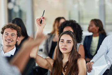 Image showing Business woman, hand up and questions at seminar, conference or meeting. Audience, female person and hands raised for question, asking or answer, crowd vote and training at workshop presentation.