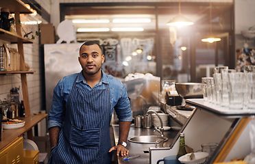 Image showing Coffee shop, barista and portrait of man in restaurant for service, working and standing in cafe bar. Small business owner, bistro startup and male entrepreneur by cafeteria counter ready to serve