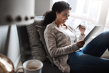 Image showing Credit card, tablet and girl and online shopping, ecommerce in home or paying for product, retail or internet finance. Black woman, banking and money for purchase, digital payment or delivery