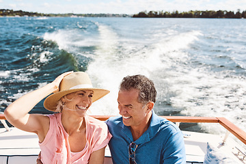 Image showing Ocean, happy couple and on a boat for retirement travel, summer freedom and holiday in Bali. Smile, love and a senior man and woman on a yacht for vacation adventure, luxury and a cruise date