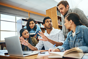 Image showing College, talking and students studying in a library for a group project, teamwork and education. Diversity, laptop and friends speaking about university notes, knowledge and planning research