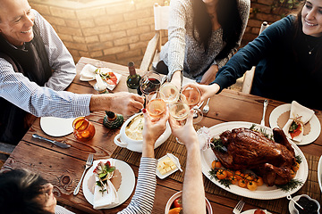 Image showing Food, wine toast and people together for celebration, holiday or dinner party with healthy meal. Above group of friends or family hands cheers to celebrate with drinks, lunch and chicken or turkey