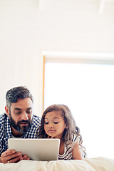 Image showing Love, digital tablet and father with daughter on a bed for reading, story and learning in their home together. Family, streaming and parent and girl relax in bedroom online with ebook or subscription