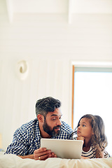 Image showing Bed, digital tablet and daughter with father relax with reading, story and learning in their home together. Love, conversation and parent and girl relax in bedroom online for subscription service