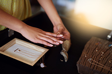 Image showing woman, hands and shopping for a ring at a jewellery store for fashion, luxury accessory and fun. Female person or customer in a retail shop for choice, offer or sale on jewelry product on a counter