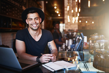 Image showing Portrait, smile and man in a cafe, barista and startup success with a laptop, planning and manager. Face, male employee and entrepreneur with a notebook, coffee shop and business owner with happiness