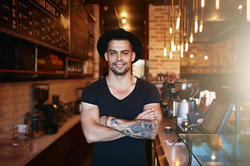 Image showing Portrait, smile and man with arms crossed, cafe and barista with startup success, restaurant and happiness. Face, happy male person and entrepreneur in a coffee shop, employee and business owner