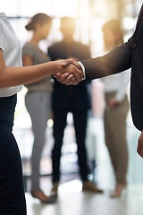Image showing Bussiness people, shaking hands and partnership deal at meeting for networking, b2b and success. Professional man and woman together for handshake, corporate partner and introduction or agreement