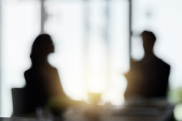 Image showing Silhouette, blur and business people in meeting in office for discussion, planning and conversation. Corporate workplace, collaboration and blurred man and woman in conference room for partnership