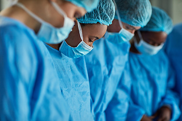 Image showing Healthcare, group of surgeons working a medical operation and in a hospital building. Teamwork or collaboration, surgery and medic team or doctors with scrubs on with focus at clinic.