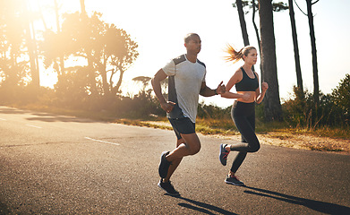 Image showing Fitness, running and freedom with couple in road for workout, cardio performance and summer. Marathon, exercise and teamwork with black man and woman runner in nature for sports, training and race