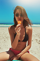 Image showing Ice cream, beach swimsuit and woman portrait on holiday by the sea and blue sky with happiness. Sun, sand and young female person face with eating and lens flare by the ocean in summer on vacation