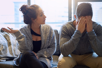 Image showing Divorce, conflict and couple on a couch, talking and communication with argument, home and fight. Partners, man or woman on a sofa, relationship problem and marriage issue with crisis and frustration