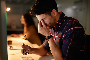 Image showing Stress, headache and burnout with a man programmer working on a computer in his office for design. Tired, 404 and deadline with a male employee working on system code for software development