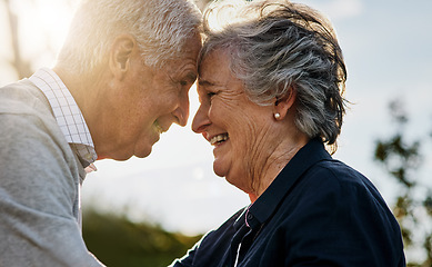 Image showing Love, nature and senior couple intimate or face together and outdoors or happy in retirement. Mature, man and woman forehead smile in vacation or senior citizens care and embrace date at the park.