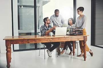 Image showing Strategy, laptop and coaching with business people in meeting for project management, review or planning. Technology, website and training with group of employees in office for collaboration and idea