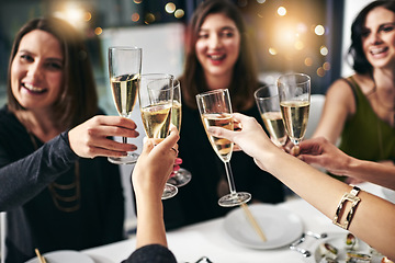 Image showing Food, party and champagne with friends at restaurant for celebration, wine and social event. Happy, diversity and toast with group of people eating together for fine dining, cheers and free time