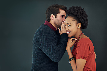 Image showing Business, man and woman with gossip, news and speaking against a dark studio background. Female person, happy male employee and staff with discussion, secret and privacy with trust, chat and story