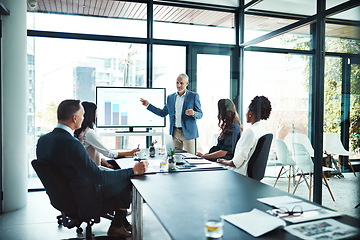 Image showing Business, charts and man with presentation, office and conversation for project, profit growth and meeting. Male leader, staff or group with teamwork, graphs or partnership in a boardroom or planning