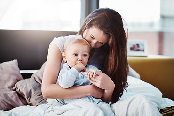 Image showing Mother, baby and hug in bed with love or bedroom, peace in morning and newborn together, relax and calm mom in home. Postpartum, boy and quality time with mama to enjoy, support or care for child