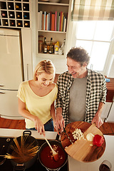 Image showing Top view, spaghetti or happy couple in the kitchen cooking with healthy vegetables for meal or dinner together. Love or funny woman laughing or helping mature husband in food preparation in Australia