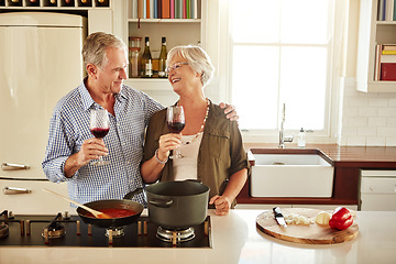 Image showing Love, wine or happy old couple cooking food for a healthy diet together with love in retirement at home. Hugging or happy senior woman laughing or drinking in kitchen with mature husband at dinner