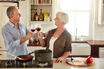 Image showing Cheers, happy or old couple cooking food for a healthy vegan diet together with love in retirement at home. Smile, toast or senior woman drinking wine in kitchen to celebrate with husband at dinner