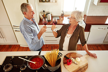 Image showing Toast, wine or old couple cooking food for healthy vegan diet together in retirement at home. Above, cheers or romantic senior woman drinking or toasting in kitchen with a happy husband at dinner