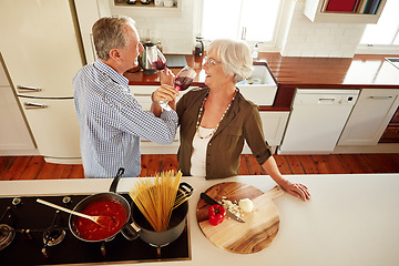 Image showing Romance, wine or happy old couple cooking food for a healthy vegan diet together with love in retirement. Romantic senior woman drinking or bonding in house kitchen with mature husband at dinner