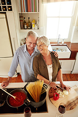 Image showing Affection, smile or happy old couple kitchen cooking with love or healthy food for dinner together at home. Embrace or above of senior woman helping or hugging an elderly husband in meal preparation