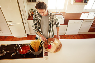 Image showing Food, cooking or above of man in kitchen with healthy vegan diet for nutrition or vegetables at home in Australia. Wine glass, spaghetti or male person in house kitchen in preparation for dinner meal