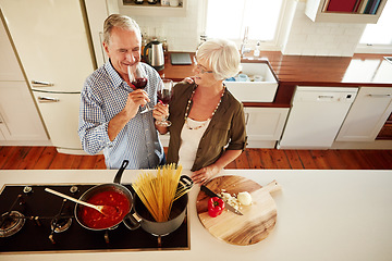 Image showing Top view, wine or old couple cooking food for a healthy vegan diet together with love in retirement at home. Happy senior woman drinking or bonding in house kitchen with mature husband at dinner