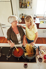 Image showing Teaching, woman or happy mother cooking food for a healthy diet together with love in family home. Funny, above or adult child learning or helping senior mom in house kitchen for lunch meal or dinner