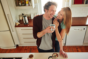 Image showing Hugging, tea or happy couple laughing in kitchen at home bonding or enjoying quality time together. Embrace, affection or above of funny mature man relaxing or drinking coffee with woman at home