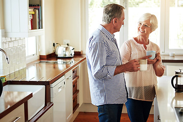 Image showing Chat, coffee or old couple talking in a kitchen at home bonding or enjoying quality time together. Happy, retirement or mature man in conversation, relaxing or drinking tea espresso with senior woman