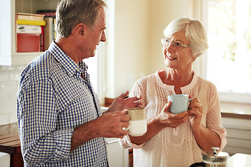 Image showing Chat, coffee or old couple talking in kitchen at home bonding or enjoying quality morning time together. Happy, retirement or senior man speaking, relaxing or drinking tea espresso with woman at home