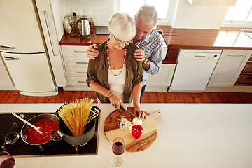 Image showing Affection, support or old couple kitchen cooking with love or healthy food for lunch together at home. Hug, embrace or above of senior woman helping an elderly romantic husband in meal preparation