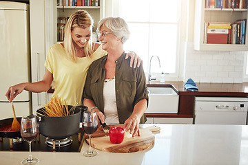 Image showing Hug, happy mother or woman cooking food for healthy vegan diet together with love in family home. Smile, embrace or adult child hugging or helping senior mom in house kitchen for lunch meal or dinner