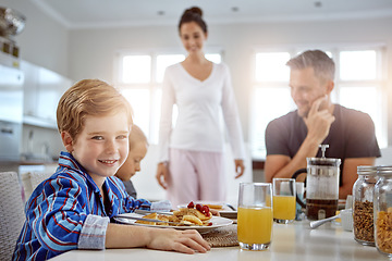 Image showing Child, portrait and pancakes for breakfast in a family home with love, care and happiness at a table. A happy woman, man and kids eating food together in morning for health, happiness and wellness