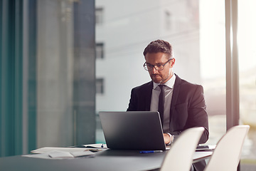 Image showing Business man, corporate office and laptop in online management, career planning and company software. Serious, focus and professional person or worker in conference room typing on computer or website