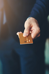 Image showing Debit card, hand and closeup of a businessman for shopping, financial bills and loans. Finance, customer and zoom of professional male person paying, buying and spending money at a retail store.