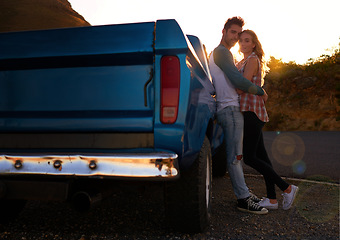Image showing Couple, portrait and sunset by pickup truck for road trip with love, romance or date on adventure, travel or journey. Man, woman and hug for care, mockup and transportation for outdoor in countryside