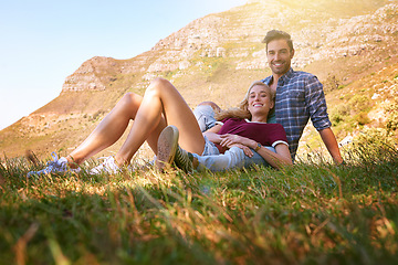 Image showing Relax, love and portrait of couple in nature for carefree, bonding and affectionate. Happiness, date and romance with man and woman cuddle in grass field for summer break, happy and mountains