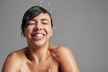 Image showing Shower, cleaning and face of woman with water in studio on gray background for wellness, beauty and grooming. Skincare, bathroom and happy female person with splash for washing, hygiene and cleansing