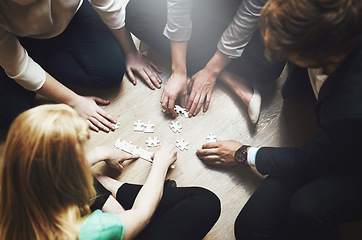 Image showing Puzzle, group and teamwork of people solution, collaboration and workflow, problem solving and thinking. Team building game, project development and women in circle on floor, synergy or brainstorming