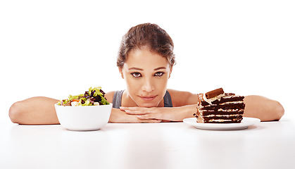 Image showing Portrait, food and choice with a woman in studio on a white background to decide between a salad or cake. Diet, nutrition or health with a chocolate dessert and a healthy bowl of fresh vegetables