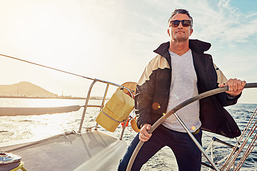 Image showing Water adventure, rich man sailing on a yacht and retirement on sea with in blue sky. Travel or freedom, sunshine or relax and mature male on summer vacation or holiday break on cruise boat.