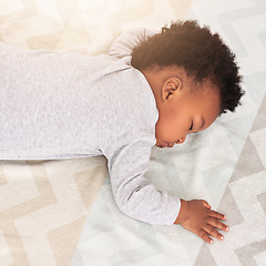 Image showing Baby, african boy and sleeping in bedroom for rest, health and peace for growth, development and relax in family home. Black male infant, tired and sleep on bed with fatigue, quiet and calm in house