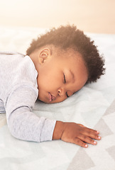 Image showing Comfort, bed and baby sleeping in home on blanket for rest, nap time and dreaming in nursery. Childcare, newborn and cute, tired and African child in bedroom sleep for comfortable, relaxing and calm